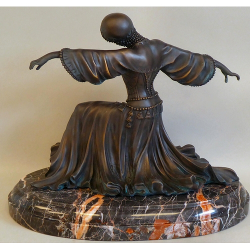 39 - A modern Art Deco style patinated bronzed metal figure, a female dancer, on a marble plinth  12... 