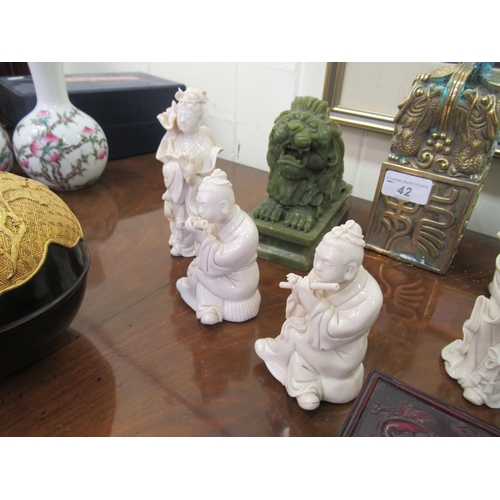 42 - Oriental collectables: to include a Chinese porcelain blanc de chine figure, a deity  5.5