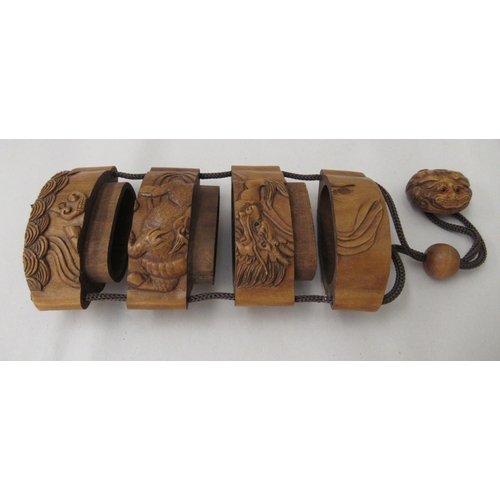 45 - Three 20thC Japanese carved fruitwood, two and three part inro, decorated with various animals