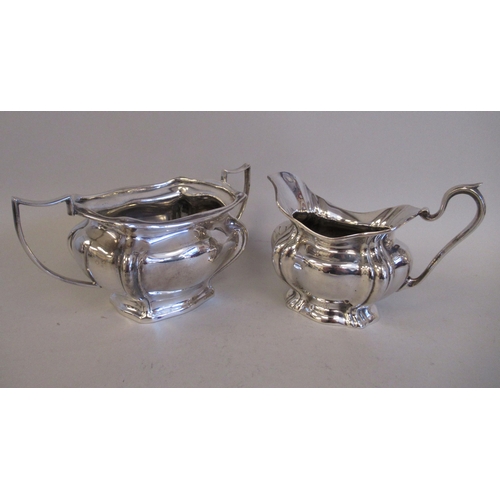 62 - Silver plated tableware: to include a three piece tea set; and an oval bread basket  12