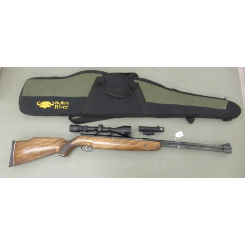 84 - A Weihrauch HW77 .22 air rifle with attached Hawke 3-9x50 scope, Armson OEG sight and soft case