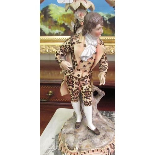 100 - A pair of post 1950s European (possibly Austrian) porcelain triple branch candelabra, decorated with... 