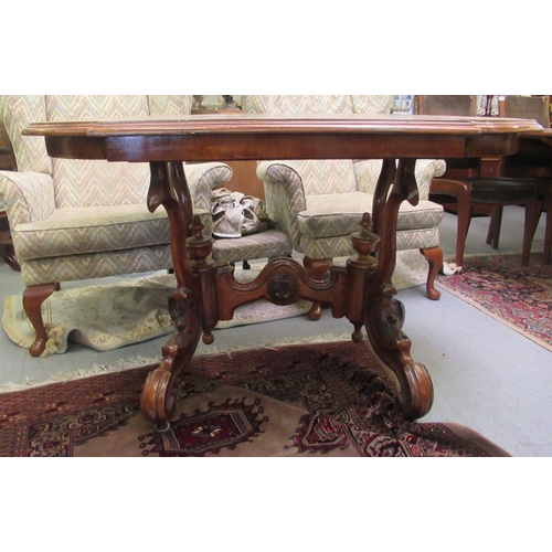 109 - A late Victorian crossbanded mahogany centre table, the top with a moulded breakfront edge, raised o... 