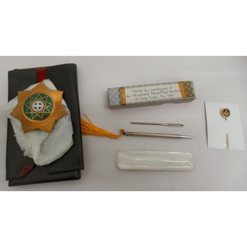 110 - Masonic related collectables: to include a 9ct gold pin; ephemera and badges&nbsp;