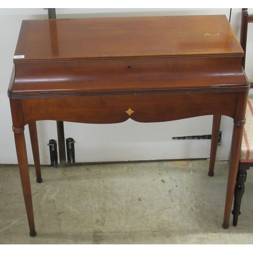 113 - A modern cherrywood dressing chest/desk with a hinged mirrored lid and fall front, enclosing open co... 