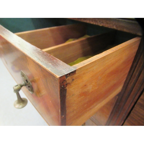 145 - A 1930s mahogany bow front sideboard with a central bank of three drawers, flanked by a pair of pane... 