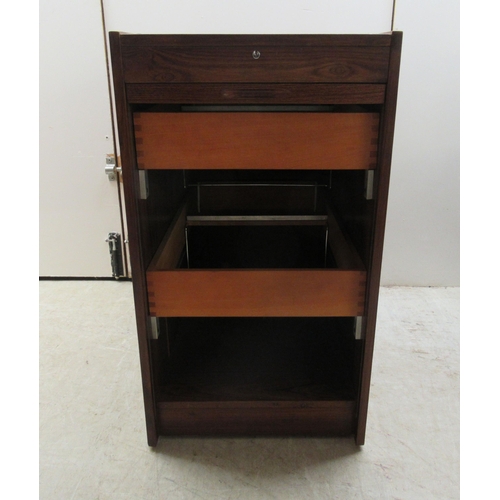 181 - A mid 20thC Scandinavian rosewood finished filing cabinet, the lockable vertically sliding tambour f... 