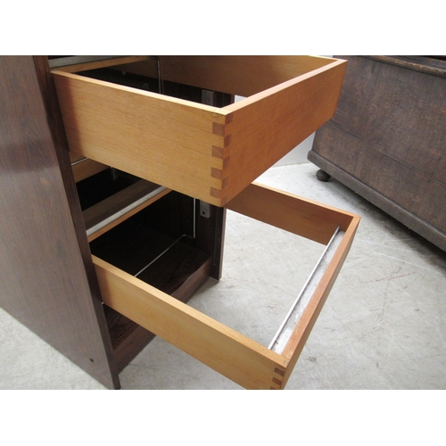 181 - A mid 20thC Scandinavian rosewood finished filing cabinet, the lockable vertically sliding tambour f... 