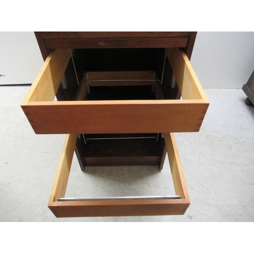 181 - A mid 20thC Scandinavian rosewood finished filing cabinet, the lockable vertically sliding tambour f... 