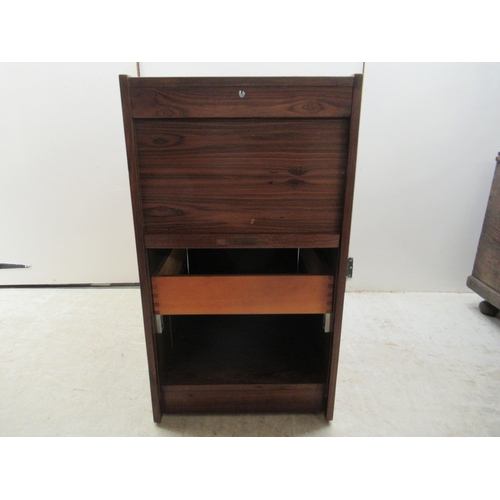 181 - A mid 20thC Scandinavian rosewood finished filing cabinet, the lockable vertically sliding tambour f... 