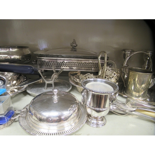 184 - Silver plated and other metal tableware: to include a four division wire toastrack; and a glass entr... 