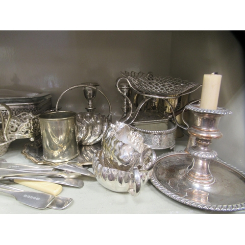 184 - Silver plated and other metal tableware: to include a four division wire toastrack; and a glass entr... 