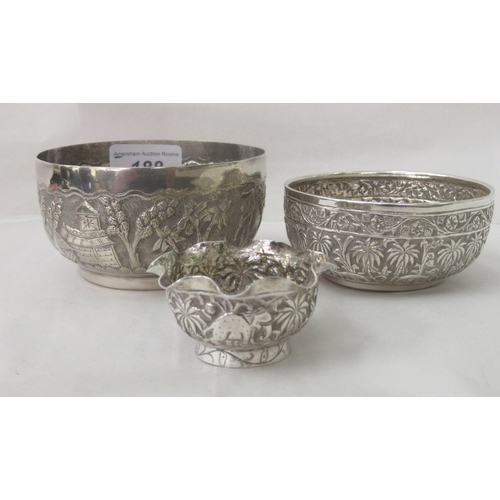 188 - Asian silver coloured/white metal wares, viz. two decoratively embossed cast and chased bowls&nbsp; ... 