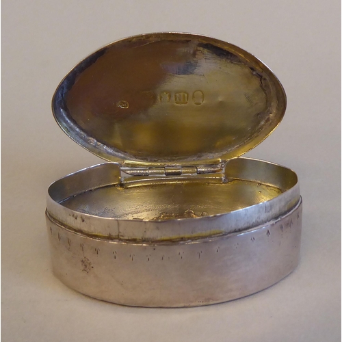 198 - A George IV silver lozenge shape patch box with scratch engraved decoration on the hinged lid  Londo... 