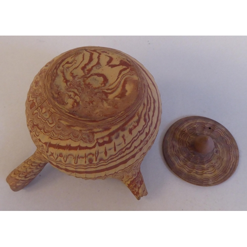 199 - An antique Japanese agate ware Saki pot of bulbous form with a short spout, side handle and cover