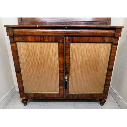 200 - A Regency goncalo alves chiffoniere with bead carved borders, the shelved upper part over a pair of ... 