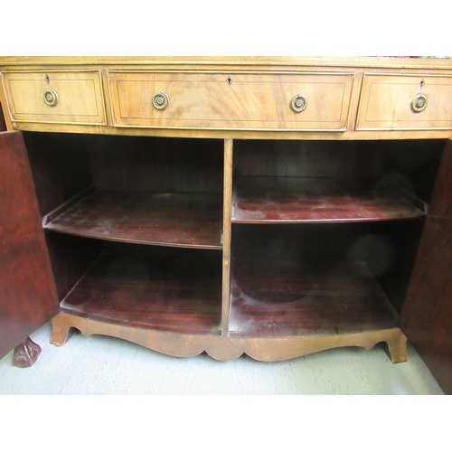 201 - A mid 20thC Hobbs & Co Regency design mahogany bowfront sideboard with three drawers and two doo... 