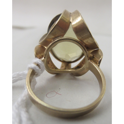 207 - A 9ct gold fancy claw set dress ring with a citrine coloured stone&nbsp;