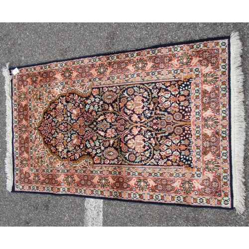 209 - A Kelim part silk prayer rug, decorated with floral designs, on a multi-coloured ground with a dark ... 