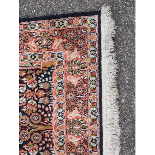 209 - A Kelim part silk prayer rug, decorated with floral designs, on a multi-coloured ground with a dark ... 