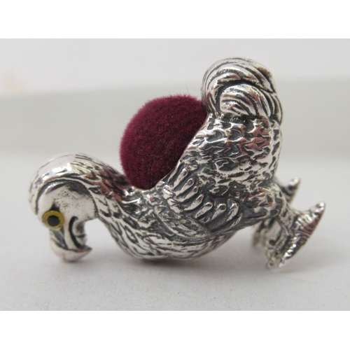 213 - A silver coloured metal novelty pin cushion, fashioned as a Dodo bird