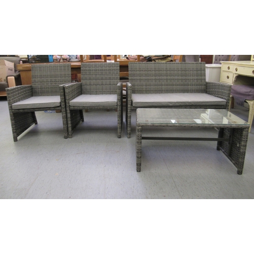 214 - A four piece grey coloured rattan terrace furniture set  comprising a two person settee, two arm cha... 