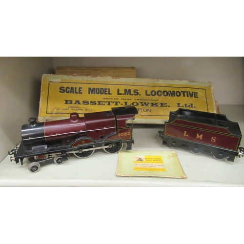 218 - A Bassett-Lowke scale clockwork model 0 gauge 4-4-6 locomotive and tender, in maroon LMS livery  box... 