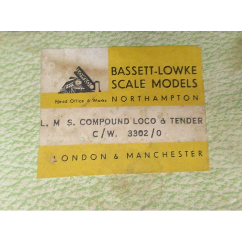 218 - A Bassett-Lowke scale clockwork model 0 gauge 4-4-6 locomotive and tender, in maroon LMS livery  box... 
