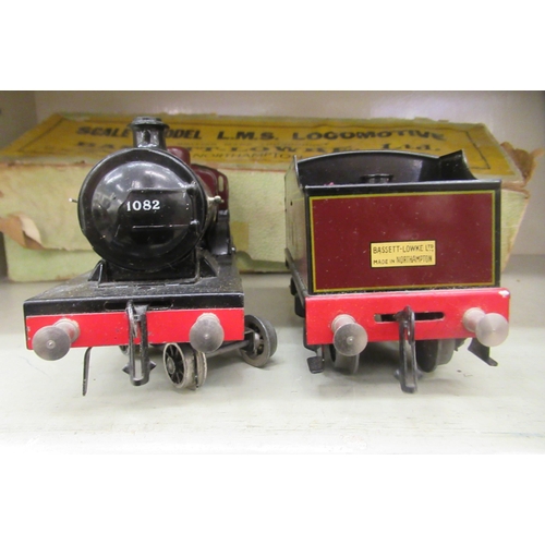 218 - A Bassett-Lowke scale clockwork model 0 gauge 4-4-6 locomotive and tender, in maroon LMS livery  box... 