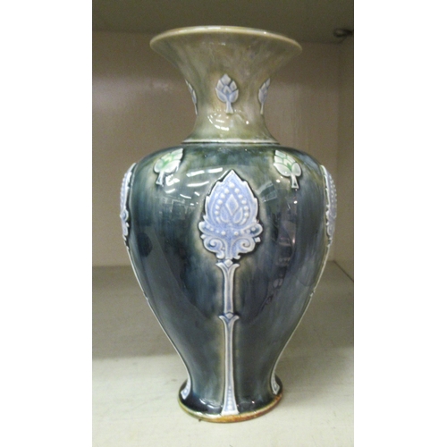 220 - A Royal Doulton green and blue glazed stoneware vase of baluster form, decorated with moulded floral... 
