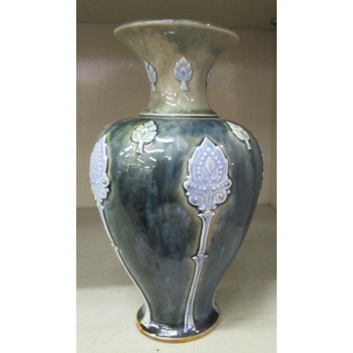 220 - A Royal Doulton green and blue glazed stoneware vase of baluster form, decorated with moulded floral... 