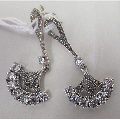 221 - A pair of Art Deco style silver coloured metal pendant earrings, set with marcasite and cubic zircon... 