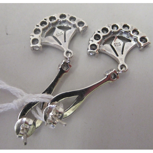 221 - A pair of Art Deco style silver coloured metal pendant earrings, set with marcasite and cubic zircon... 