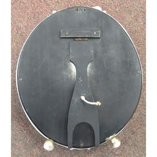 222 - A late 19thC (probably German) oval dressing table mirror, the bevelled plate set in a floral encrus... 