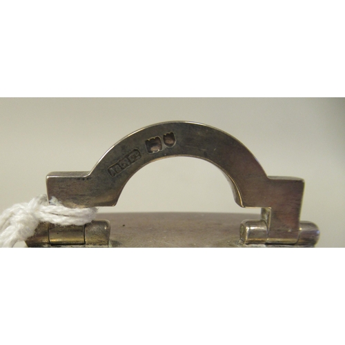 223 - An Asprey & Co traveller's miniature timepiece, the silver case of rectangular box design with a... 