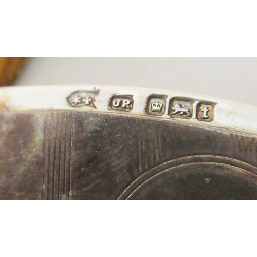 231 - A silver vesta case with a strike plate, a pendant ring and hinged lid; and a silver wine label&nbsp... 