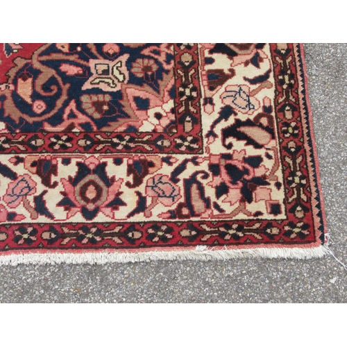 235 - A Soumak rug, decorated with repeating stylised foliate designs, on a multi-coloured ground  62