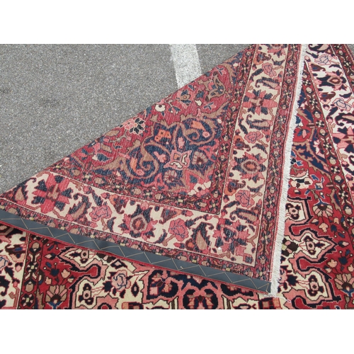 235 - A Soumak rug, decorated with repeating stylised foliate designs, on a multi-coloured ground  62