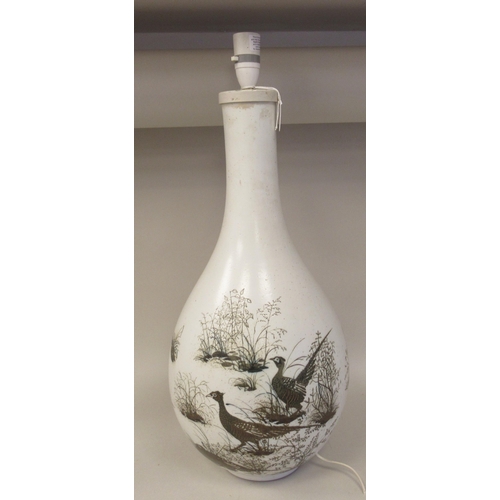 236 - A Royal Copenhagen porcelain aluminia faience table lamp of bulbous bottle vase design, decorated by... 