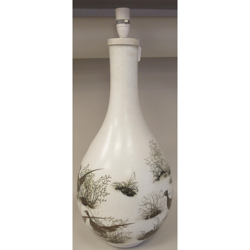 236 - A Royal Copenhagen porcelain aluminia faience table lamp of bulbous bottle vase design, decorated by... 