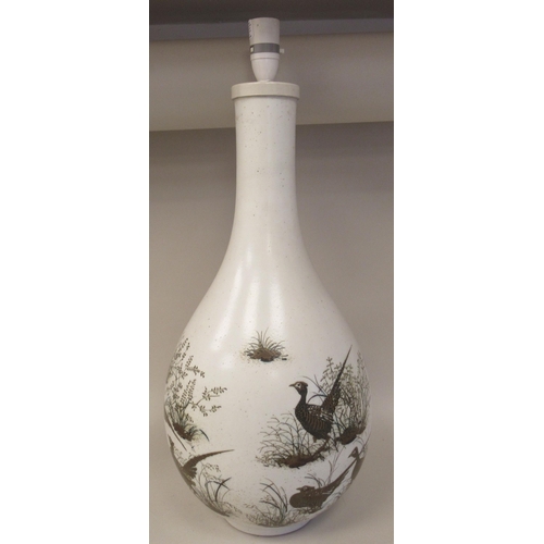 236 - A Royal Copenhagen porcelain aluminia faience table lamp of bulbous bottle vase design, decorated by... 