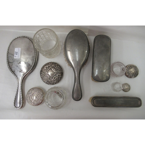 29 - Silver topped and backed dressing table accessories: to include a hand mirror&nbsp; Birmingham 1922&... 
