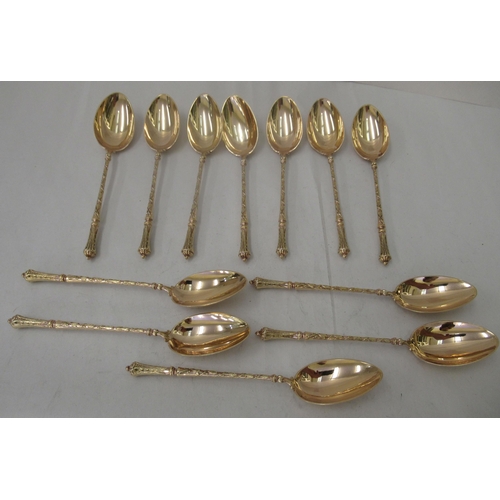 74 - A set of twelve early 20thC French silver gilt teaspoons with decoratively cast handles&nbsp;