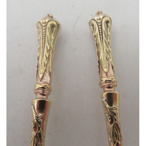 74 - A set of twelve early 20thC French silver gilt teaspoons with decoratively cast handles&nbsp;