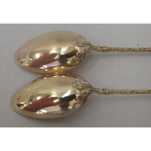 74 - A set of twelve early 20thC French silver gilt teaspoons with decoratively cast handles&nbsp;