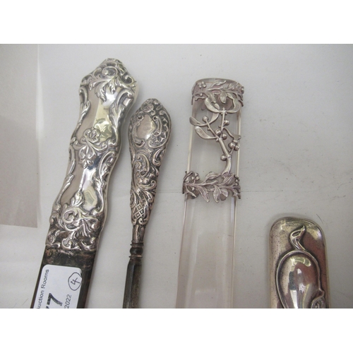 77 - Three early 20thC Art Nouveau silver page turner handles; and a contemporary silver handled button h... 