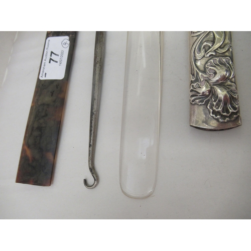 77 - Three early 20thC Art Nouveau silver page turner handles; and a contemporary silver handled button h... 