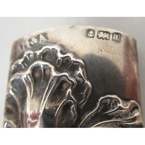 77 - Three early 20thC Art Nouveau silver page turner handles; and a contemporary silver handled button h... 