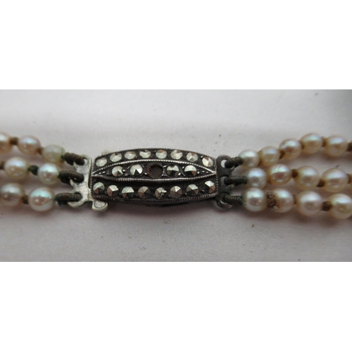 81 - Items of personal ornament: to include a 9ct gold framed cameo brooch; and a triple strand pearl nec... 