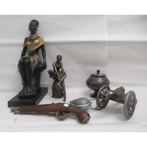 84 - Interior designer accessories: to include a painted plaster figure, a seated African woman, on a pli... 
